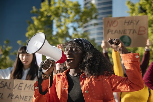 close-up-people-protesting-with-placards (1)
